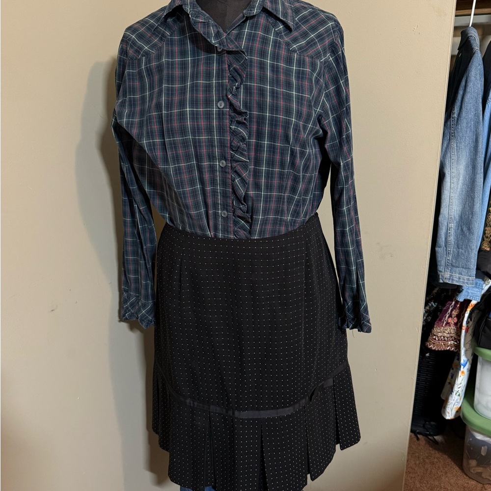 Black skirt with light pink dots woven with pleated bottom section of skirtt